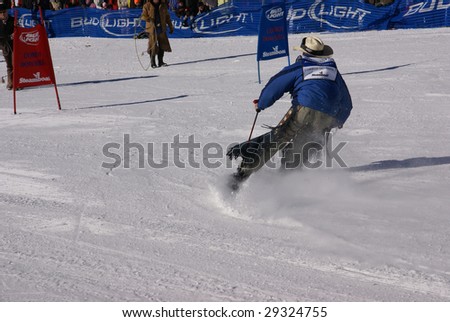 STEAMBOAT SPRINGS, COLORADO - JAN 20 :  Cowboy in chaps and stetson skis the slalom course at Cowboy Downhill, Rocky Mountains January 20, 2009 in Steamboat Springs, Colorado.