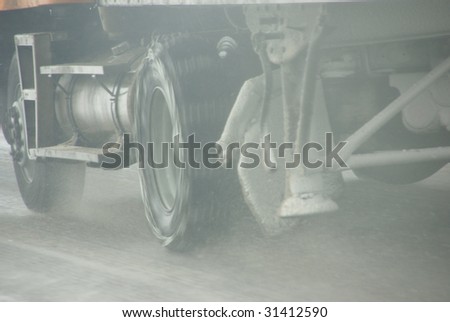 Truck tires spinning on highway during snowstorm,   Oregon, Pacific Northwest