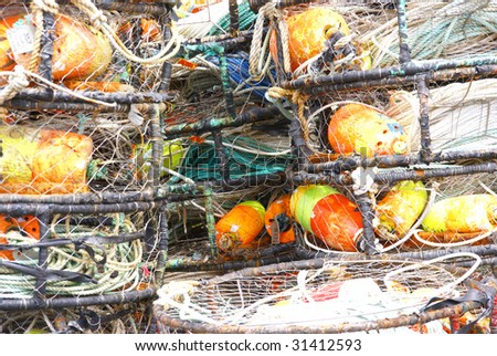 Orange and yellow crab floats, and crab traps, drying on wharf,  Newport, Oregon Coast
