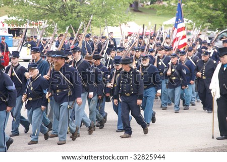 PORT GAMBLE, WA - JUN 20: Civil War reenactors participate in a mock battle. Union army marching to battle in column formation.