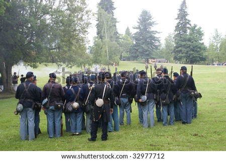 Union infantry line firing a volley,  Civil War Battle Re-enactment,  Port Gamble, WA