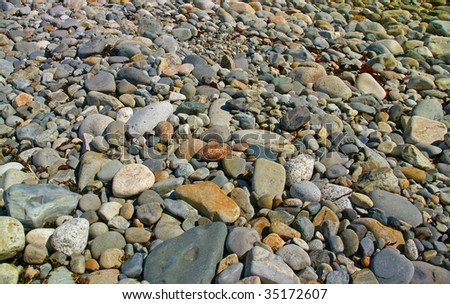 Granite pebbles, rounded by the ocean	-Acadia National Park, Mount Desert Island ,	Seawall	 , Maine, New England