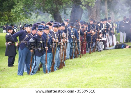 PORT GAMBLE, WA - JUN 20  - Civil War reenactors participate in a mock battle. Union infantry line firing a volley,  Civil War Battle Re-enactment, on Jun 20, 2009 in Port Gamble, WA
