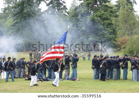 PORT GAMBLE, WA - JUN 20  - Civil War reenactors participate in a mock battle. Union infantry line firing a volley,  Civil War Battle Re-enactment, on Jun 20, 2009 in Port Gamble, WA