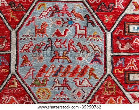 Geometric animals and birds in traditional Turkish kilim