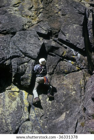 Rock climber on overhanging face,		Cascades	Pacific Northwest