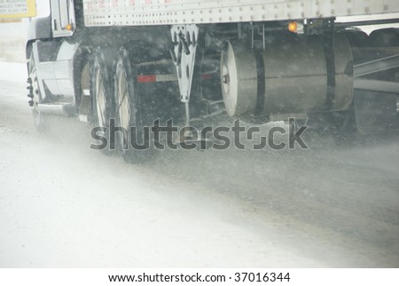 Truck tires spinning on highway during snowstorm,   Oregon, Pacific Northwest