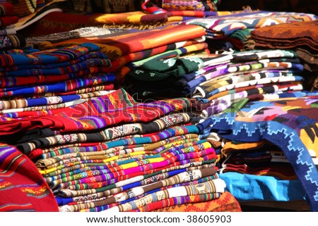Colorful handmade blankets & tablecloths, Pisac market,  Cusco, Peru, South America
