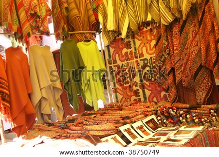 Colorful handmade blankets & tablecloths, Pisac market,  Cusco, Peru, South America