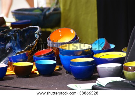 Brightly glazed bowls on display at crafts fair,   Street Fair, Pacific Northwest