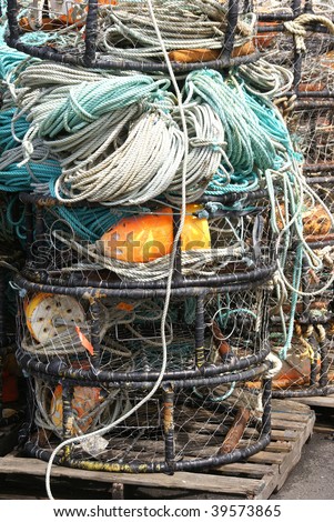 Crab traps, pots and floats, stacked on wharf,  Newport, Oregon Coast