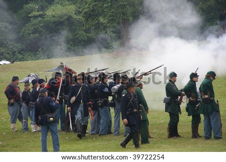 PORT GAMBLE, WA - JUNE 20 : Union infantry line fires a volley during a mock Civil War battle on June 20, 2009 in Port Gamble, WA.