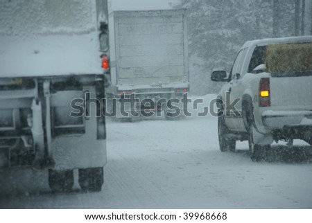 Trucks on winter highway during snowstorm,   Oregon, Pacific Northwest