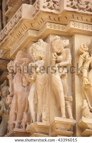 Sculptures of loving couples, illustrating the Kama Sutra, on walls of  Kandariya Mahadeva Temple at  Khajuraho in  India, Asia