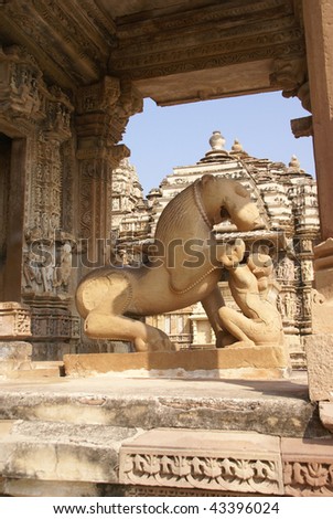 Lion and young woman, statues at  Kandariya Mahadeva Temple at  Khajuraho in  India, Asia