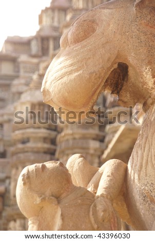 Lion and young woman, statues at  Kandariya Mahadeva Temple at  Khajuraho in  India, Asia