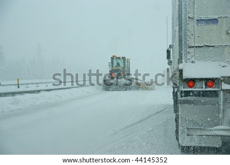 Snowplow and trucks during snowstorm in    Oregon, Pacific Northwest