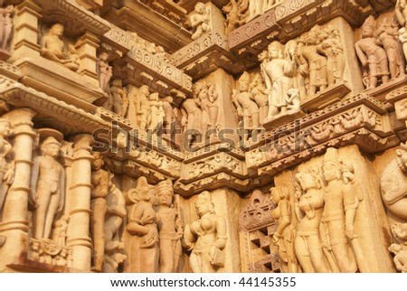 Sculptures of loving couples, mythical figures on outer walls of  Parsavanatha, Jain Temple Khajuraho,  India