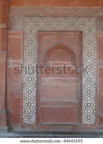Detail, Islamic  bas relief and mosaic decorations on red sandstone walls  Fatepuhr Sikri, Agra, India