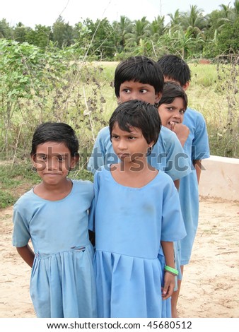 PURI, INDIA - NOVEMBER 17 : Curious Indian school children greet visiting foreign guests on November 17, 2009  in Puri, India