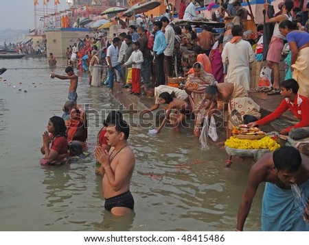 VARANASI, INDIA - NOV 6 -  Hindus perform ritual puja at dawn in the Ganges River  on Nov 6, 2009,  in Varanasi, India.