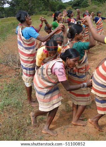 ORISSA,  INDIA - NOV 12 - Village women link arms for  Gdaba harvest dance  on Nov 12, 2009, in Lamptaput, Orissa, India
