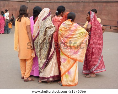 OLD DELHI, INDIA - NOV 3  - Indian women in colorful saris approach the Red Fort\'s main gate 	on Nov 3, 2009, 	in Delhi, India.