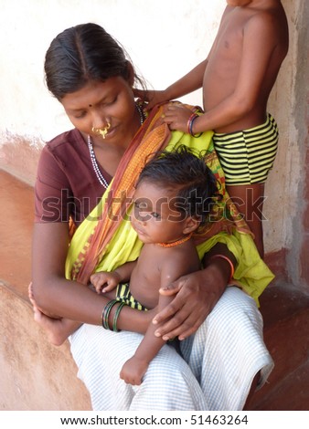 ORISSA INDIA - Nov 11 - Tribal woman poses with her children   on Nov 11, 2009 in Orissa, India