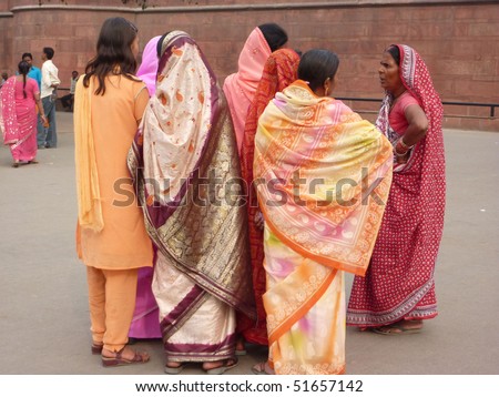OLD DELHI, INDIA - NOV 3  - Indian women in colorful saris approach the Red Fort\'s main gate  on Nov 3, 2009,  in Delhi, India.