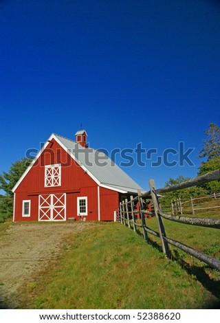 New England red barn and fence against blue sky.Mount Desert Island, Acadia National park, Maine, New England