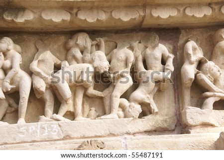 Sculptures of loving couples, illustrating the Kama Sutra, on walls of Lakshmana Temple at Khajuraho in India, Asia