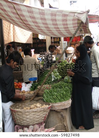 HYDERABAD, INDIA - NOV 21 : Veiled Muslim women shop for food in the Lad Bazaar on Nov 21, 2009 in Hyderabad, India