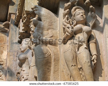 stock photo Apsara naked dancers in candid poses sculpture onVaraha 