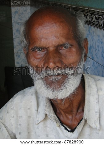 VARANASI, INDIA - NOV 7 - Old Indian man poses for his portrait in old city on Nov 7, 2009, in Varanasi, India.