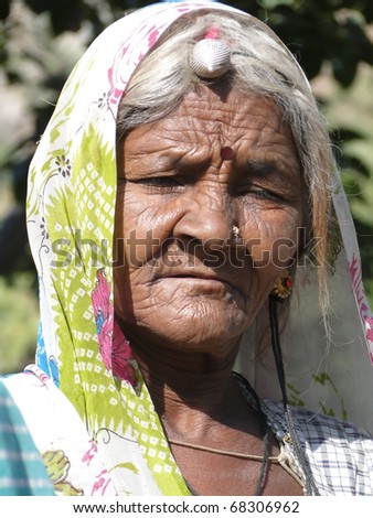 RAJASTHAN, INDIA - DEC 6 -Old  Indian woman poses for her portrait  on Dec 6, 2009, in Rajasthan, India