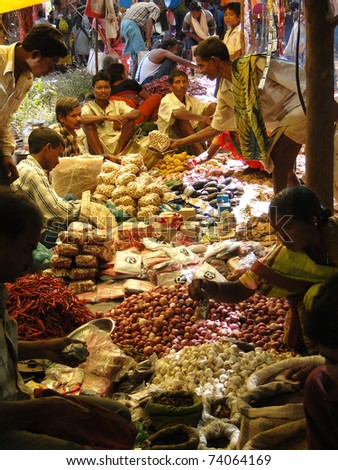 ORISSA, INDIA - NOV 10 -Tribal villagers bargain for vegetables on Nov 10, 2009, in Chatikona market, Orissa, India