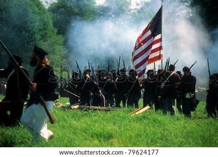 SEATTLE - JUL 10 - Union infantry line fires on advancing  Confederate soldiers, during a Civil War battle reenactment on July 10, 1996 near Seattle.