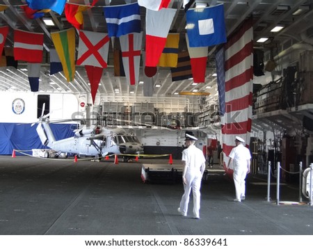 SEATTLE - AUG 4 - Naval officers hold an open house on the hangar deck of the Amphibious Assault Ship Bonhomme Richard, LDH-6, during Seafair Fleet Week  on Aug 4, 2011, in Seattle.