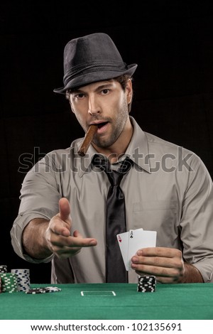 Poker player, on a Black background, throwing something. Image ready for editing, change the background and put something in front, as if the player had thrown.