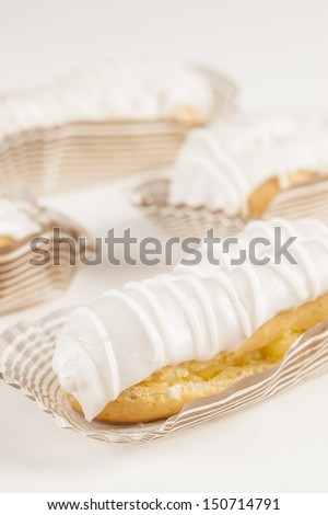Bomba de chocolate. A Brazilian traditional eclair on a white background.