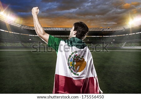 Mexican soccer player celebrating with the fans Mexican soccer player celebrating with the fans