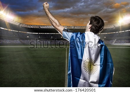 Argentinian soccer player, celebrating with the fans.