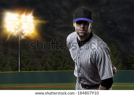 Baseball Player on a Blue Uniform on baseball Stadium.