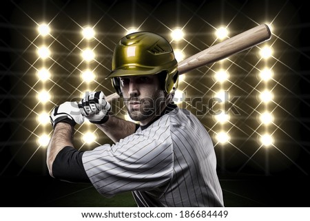 Baseball Player on a Yellow Uniform on baseball Stadium.