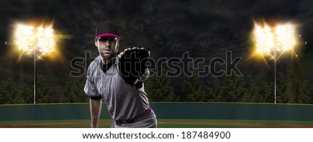 Baseball Player on a Pink Uniform on baseball Stadium.
