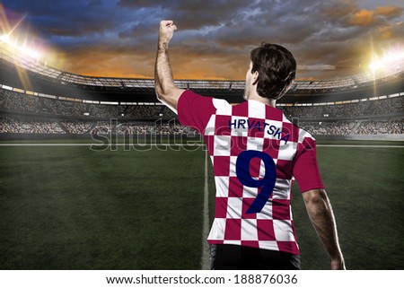 Croatian soccer player celebrating with the fans on a Stadium Croatian soccer player celebrating with the fans on a Stadium