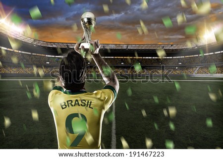 Brazilian soccer player, celebrating the championship with a trophy in his hand.