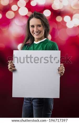 Female Mexican Fan holding a blank sign on a red lights background.