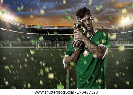 Mexican soccer player, celebrating the championship with a trophy in his hand. On a Stadium.