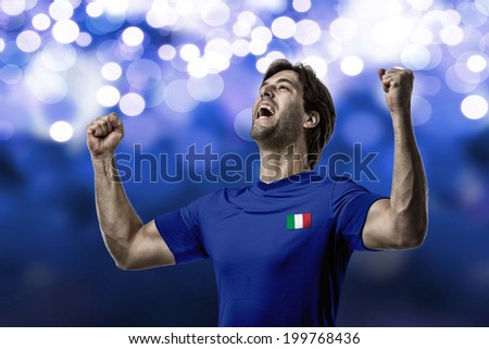 Italian soccer player, celebrating on a blue lights background.